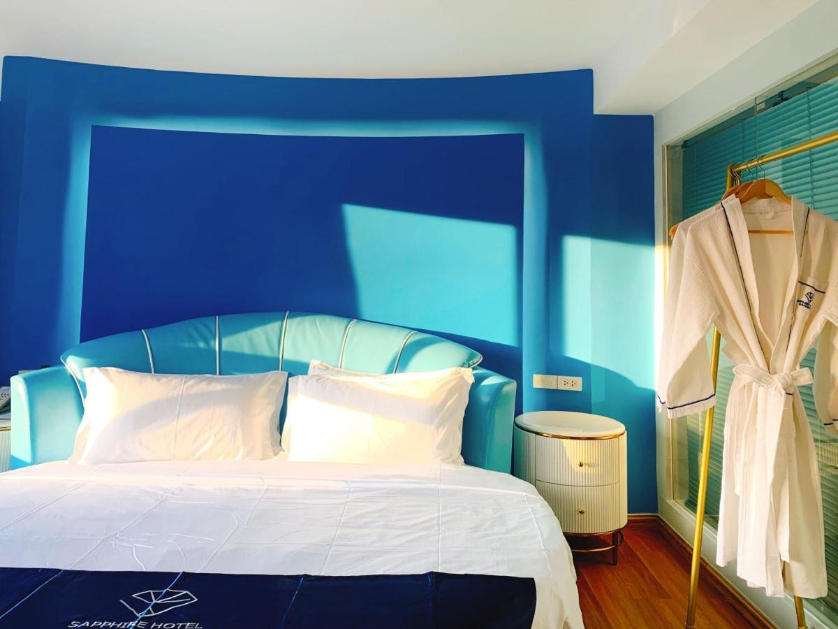 Sapphire Hotel Silom Bangkok Exterior photo A bathrobe hanging on a hanger